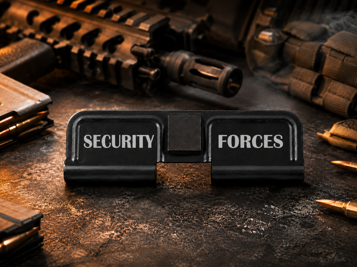 Security Forces AR-15 Dust Cover showing the engraved artwork on both sides of the black steel cover.