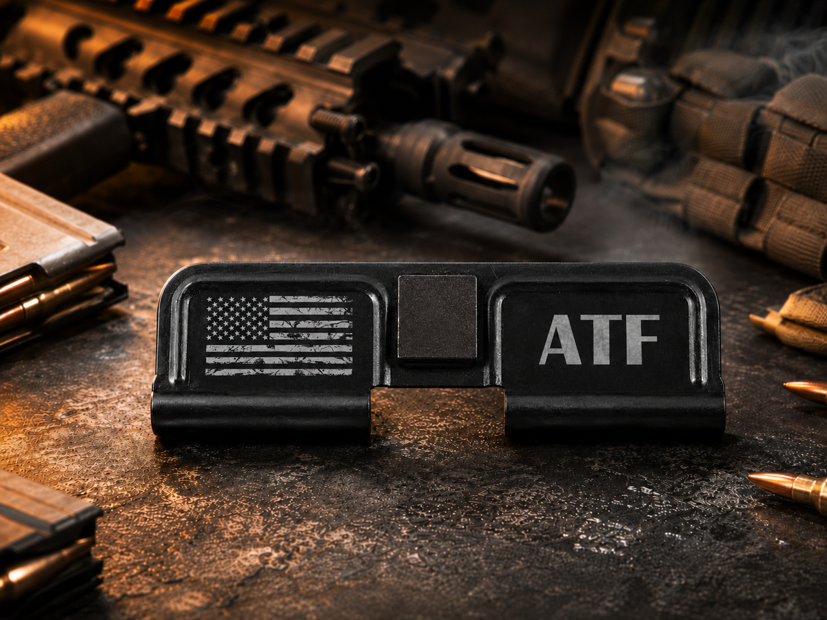 ATF AR-15 Dust Cover showing the engraved artwork on both sides of the black steel cover.