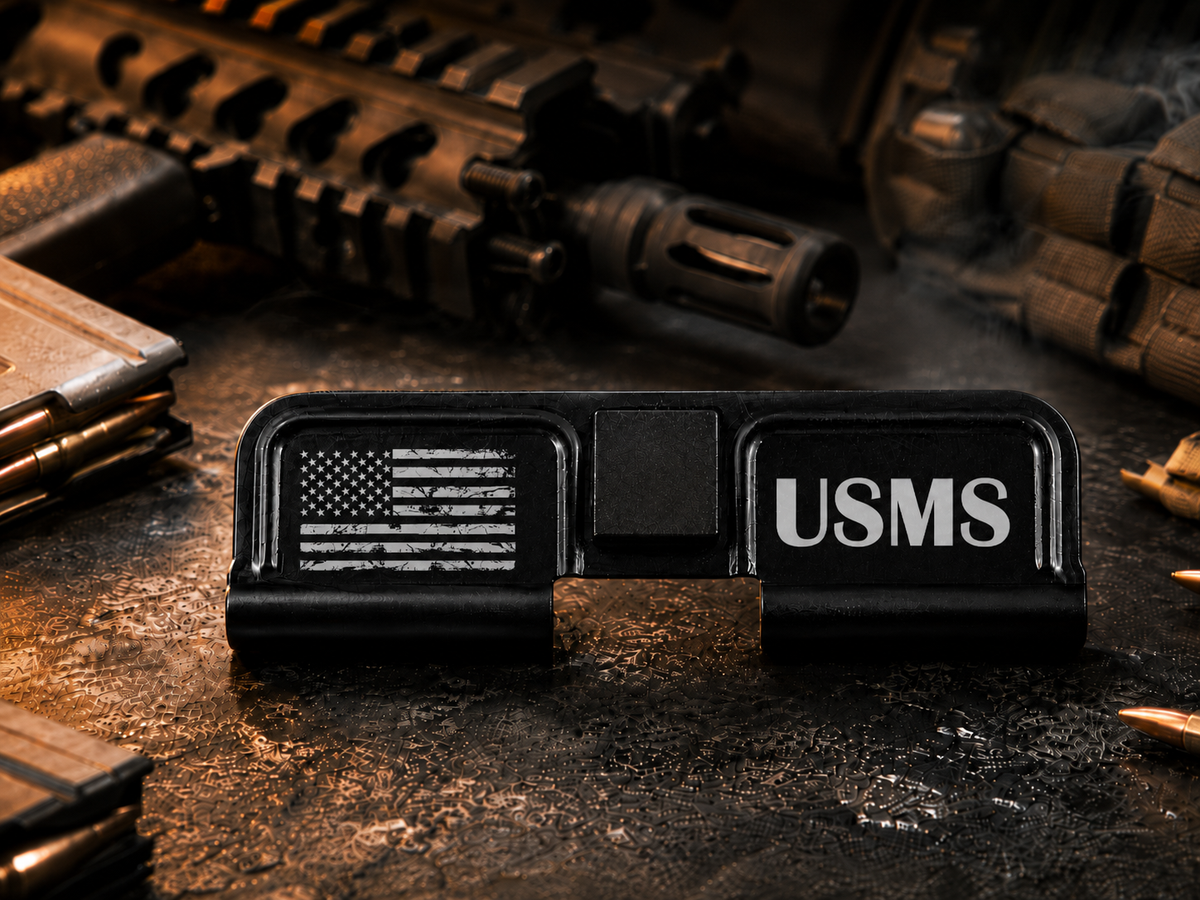 USMS AR-15 Dust Cover showing the engraved artwork on both sides of the black steel cover.