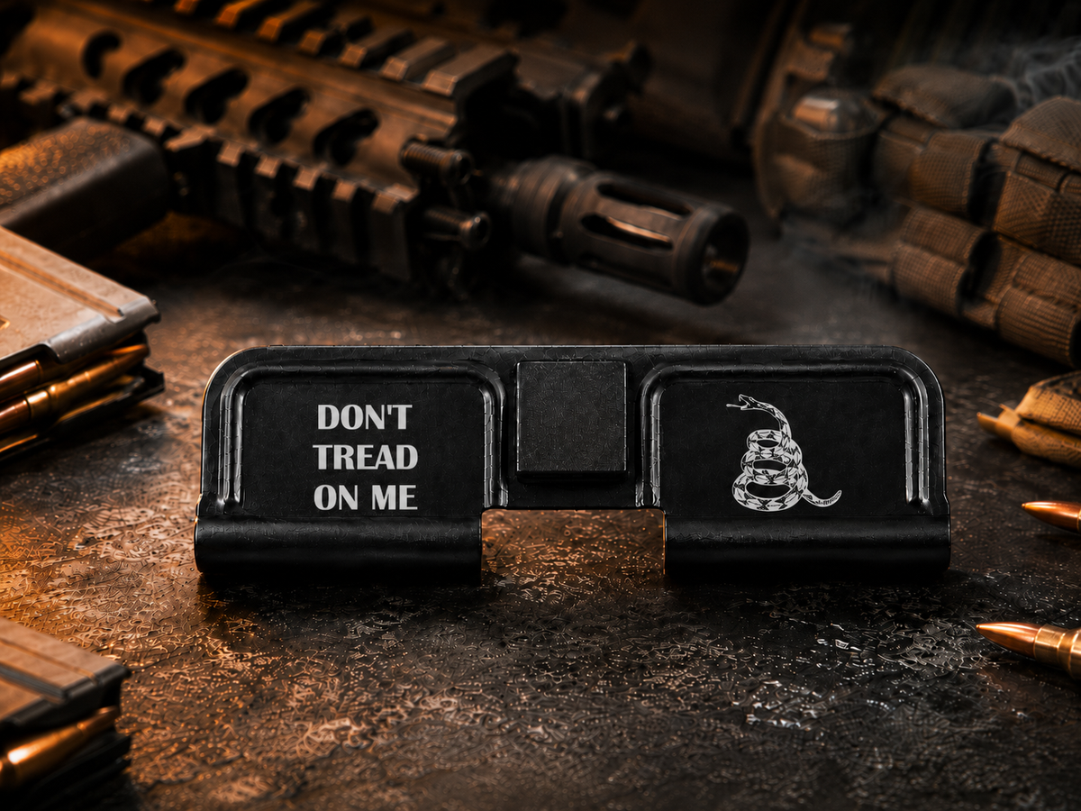 Don't Tread On Me AR-15 Dust Cover showing the engraved artwork on both sides of the black steel cover.