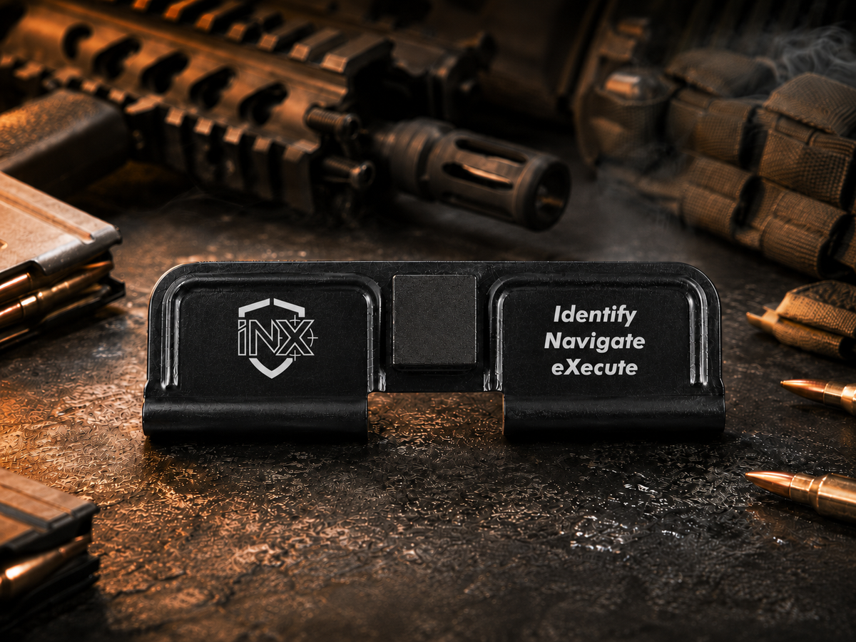 INX Tactical AR-15 Dust Cover showing the engraved artwork on both sides of the black steel cover.