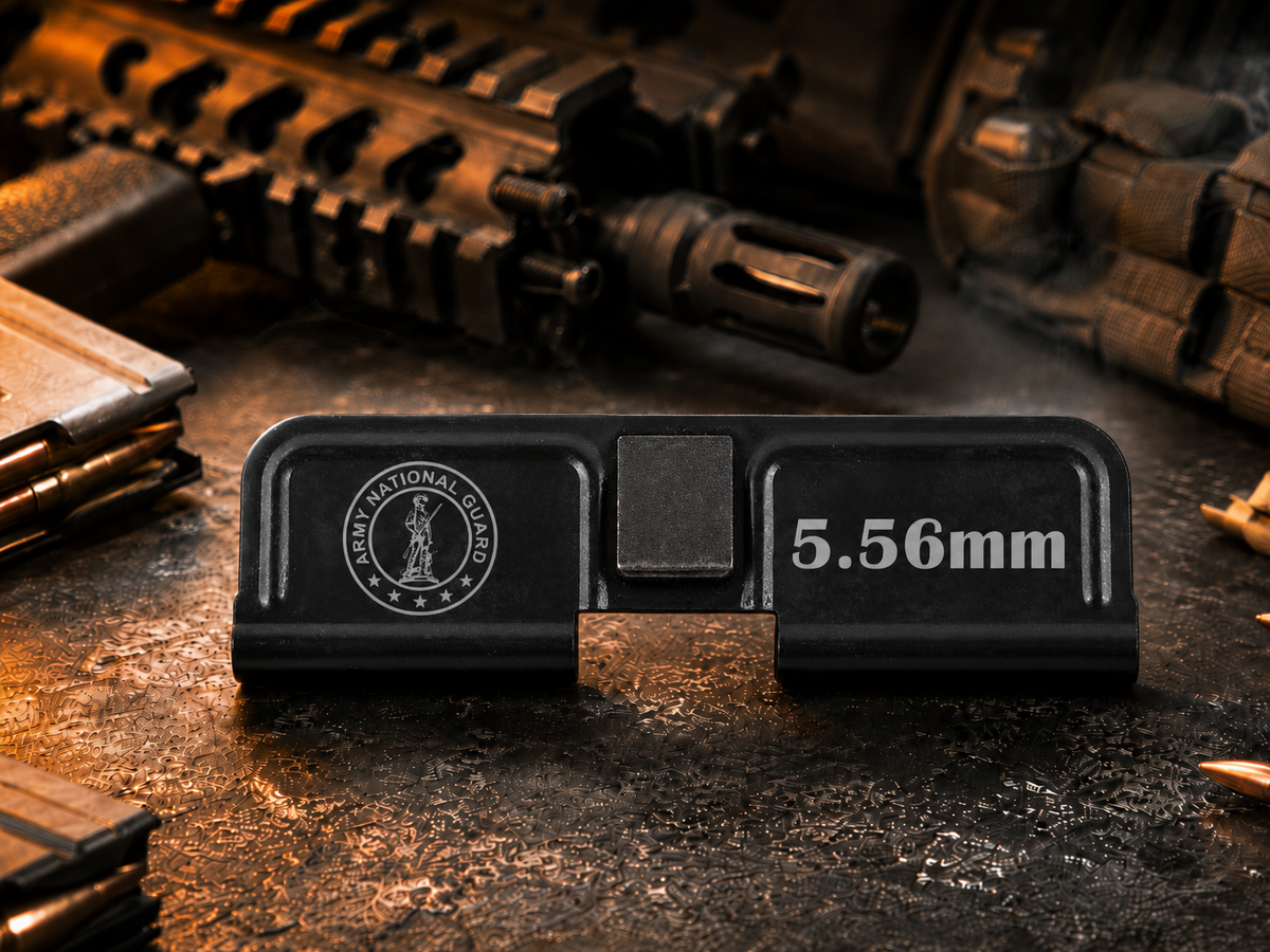 National Guard AR-15 Dust Cover showing the engraved artwork on both sides of the black steel cover.
