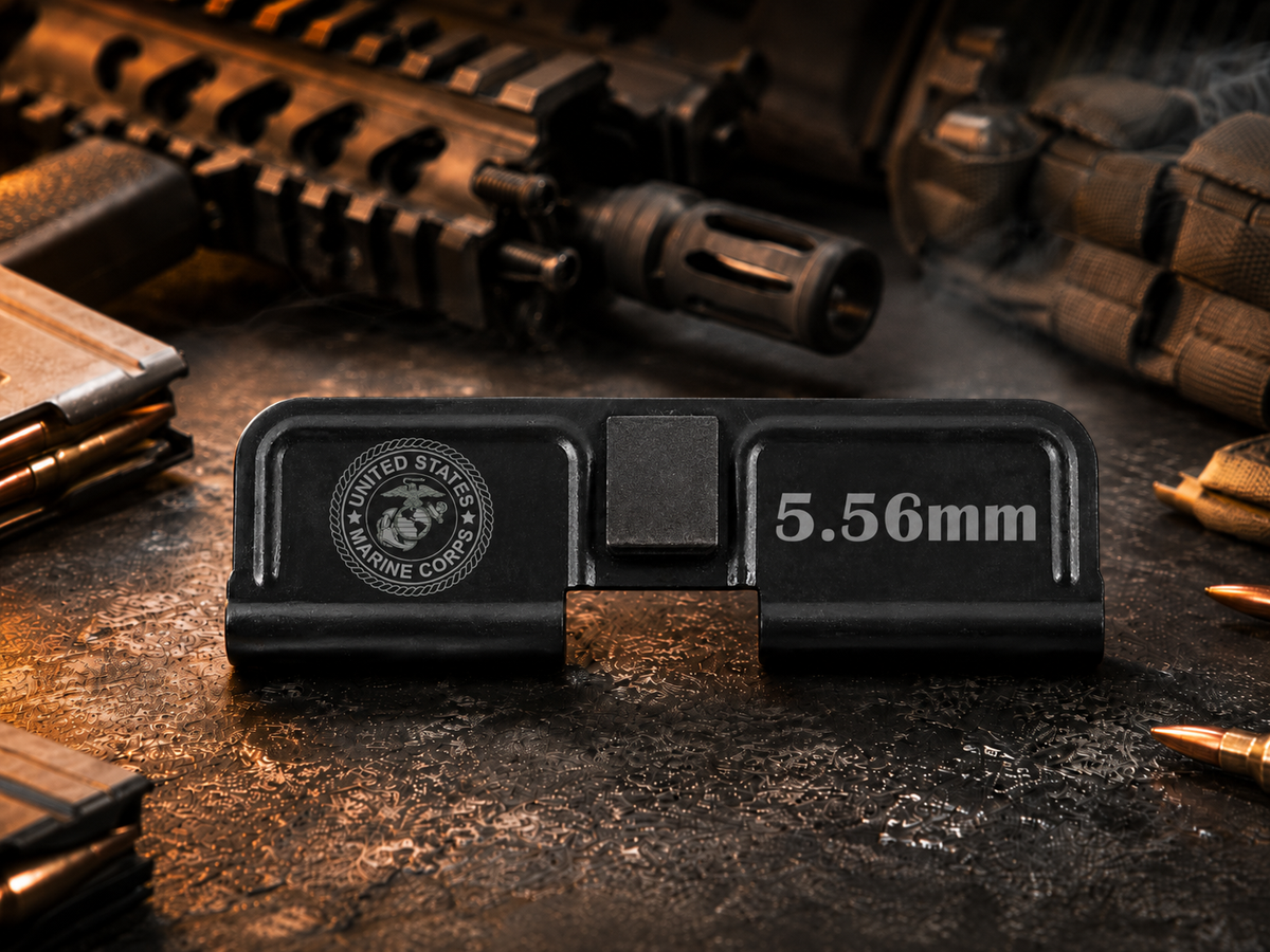 Marine Corps AR-15 Dust Cover showing the engraved artwork on both sides of the black steel cover.