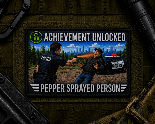 Pepper Spray Achievement Patch design with a black border on tactical gear.