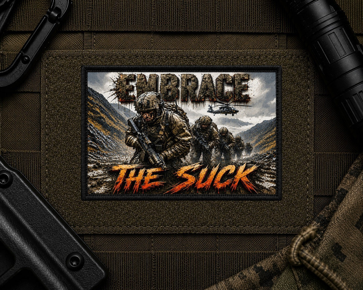 Embrace The Suck Patch design with a black border on tactical gear.