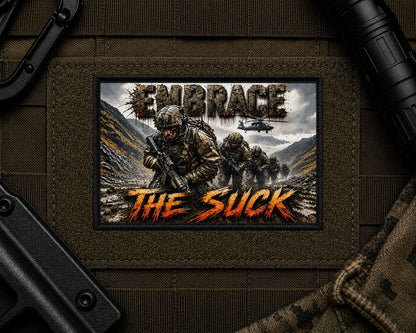 Embrace The Suck Patch design with a black border on tactical gear.