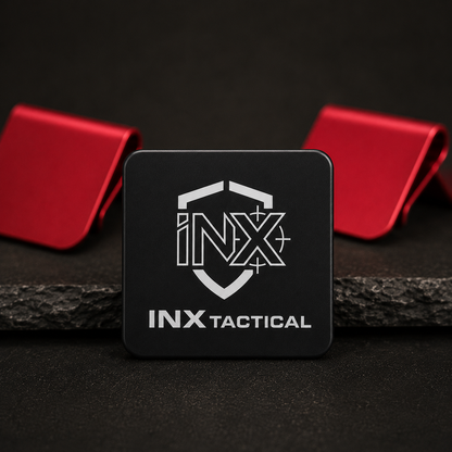 Black and red INX Tactical aluminum hat clips with engraved logos.