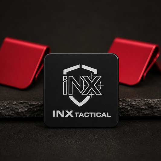 Black and red INX Tactical aluminum hat clips with engraved logos.